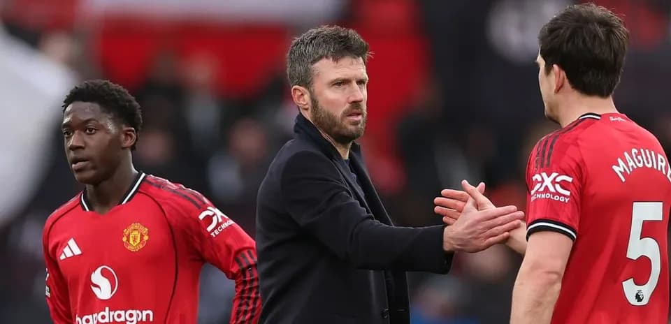 Michael Carrick greets Manchester United players after match