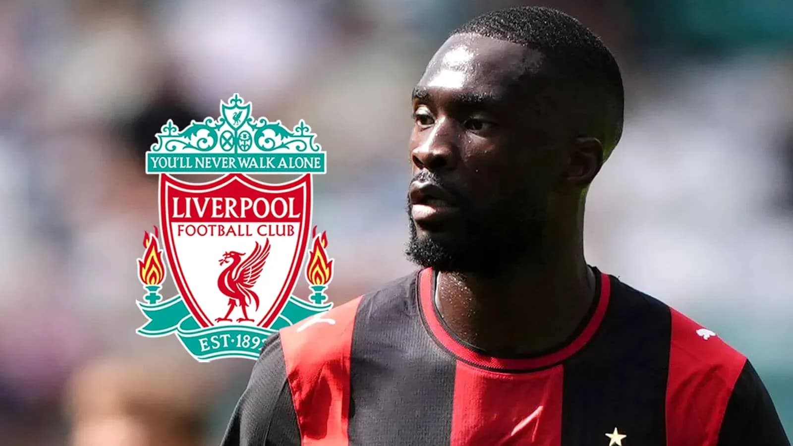 Joueur en maillot noir et rouge près du logo Liverpool