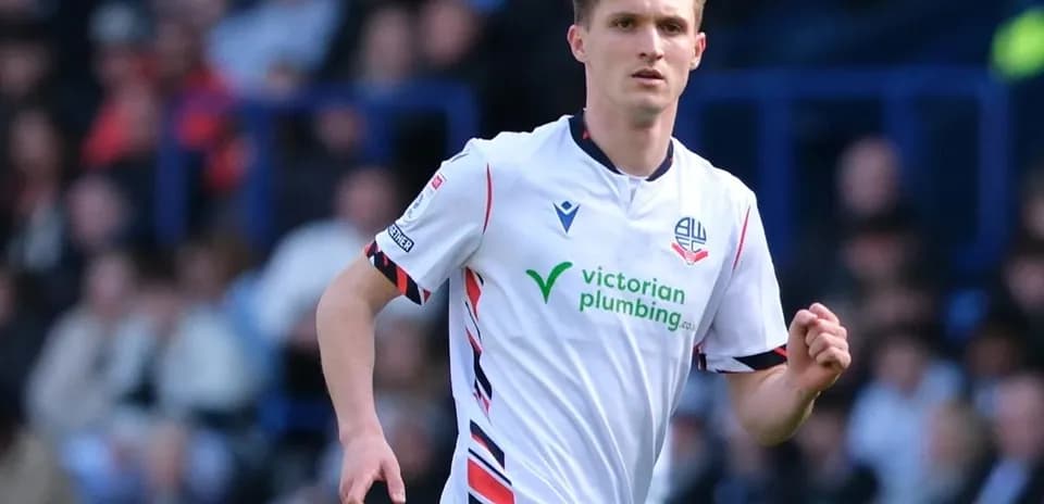 Joueur de Bolton Wanderers en action sur le terrain