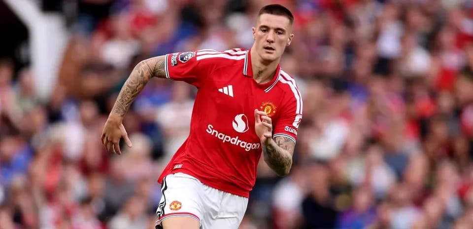 Joueur de Manchester United courant sur le terrain