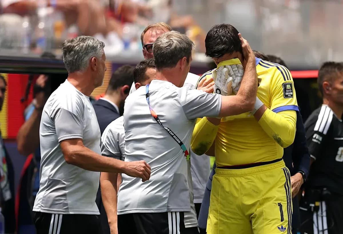 Entraîneur consolant le gardien après un match