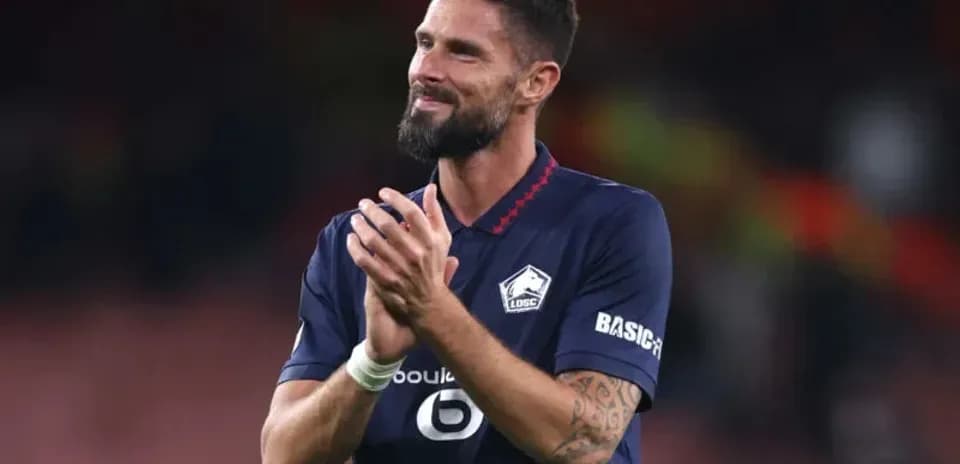 Joueur applaudissant après un match au stade