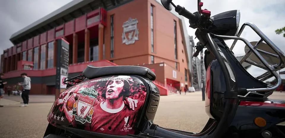 Scooter decorated with Liverpool FC emblem outside stadium