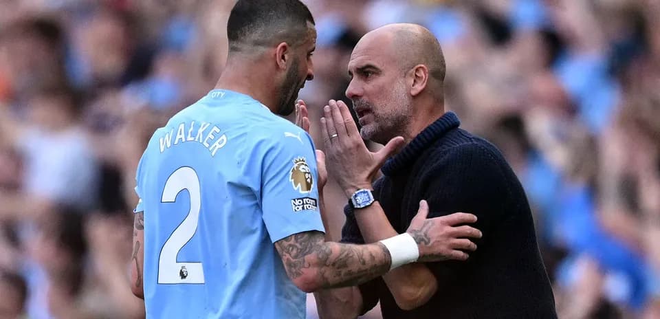 Pep Guardiola discussing strategy with Kyle Walker