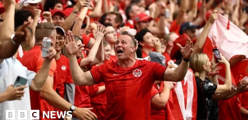 Supporters in red celebrating during a match