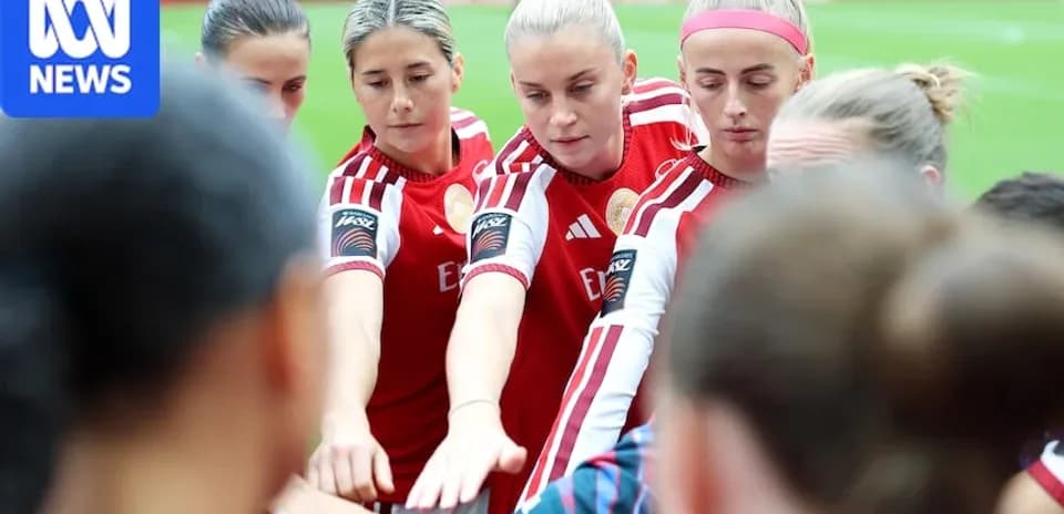 Joueuses en cercle se préparant avant le match