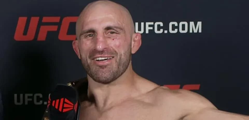 Fighter holding championship belt during interview