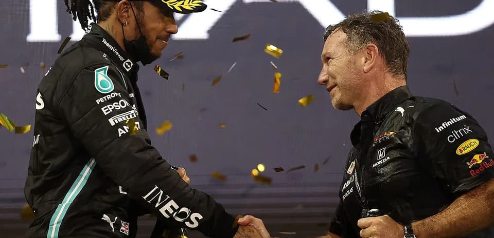Lewis Hamilton shaking hands with team principal