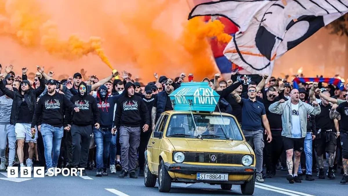 Supporters marching with flares and banners