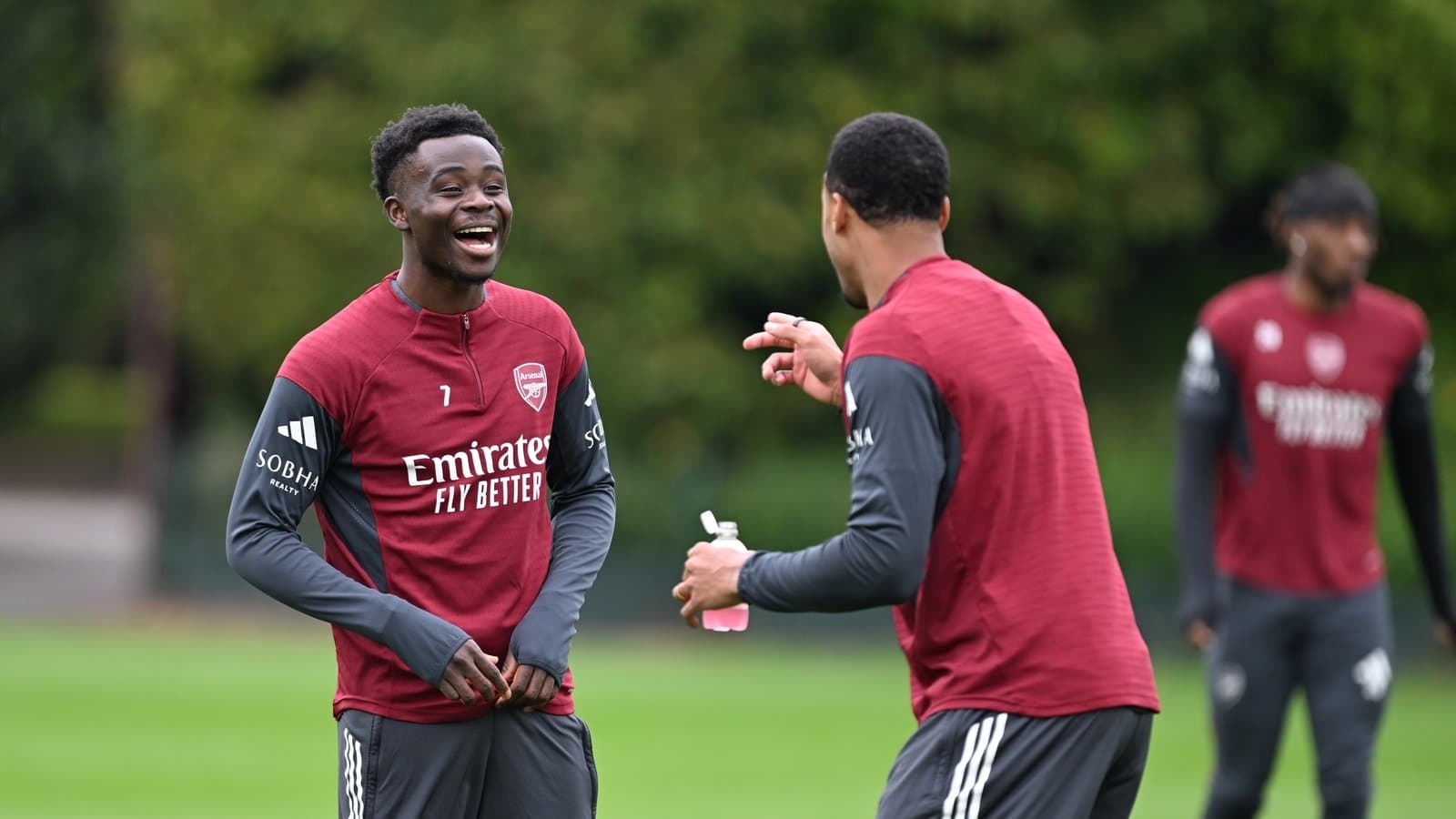 Joueurs d'Arsenal riant lors d'une séance d'entraînement