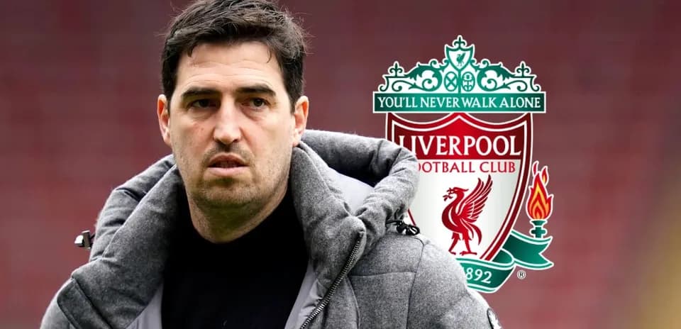 Person in a coat with Liverpool FC logo background