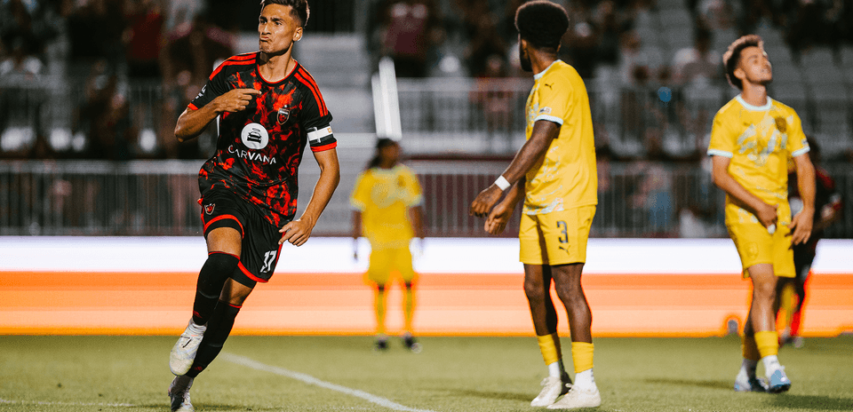 Joueur célébrant un but pendant le match