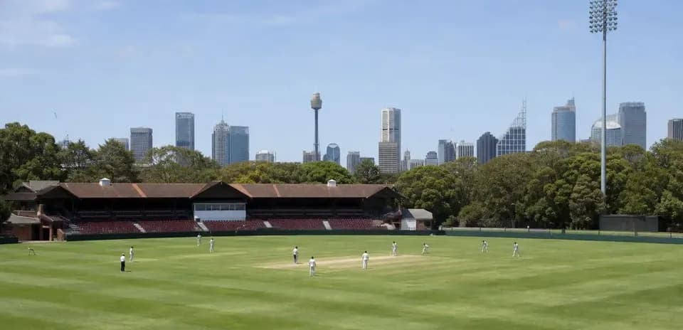 Match de cricket sur un terrain avec skyline en arrière-plan