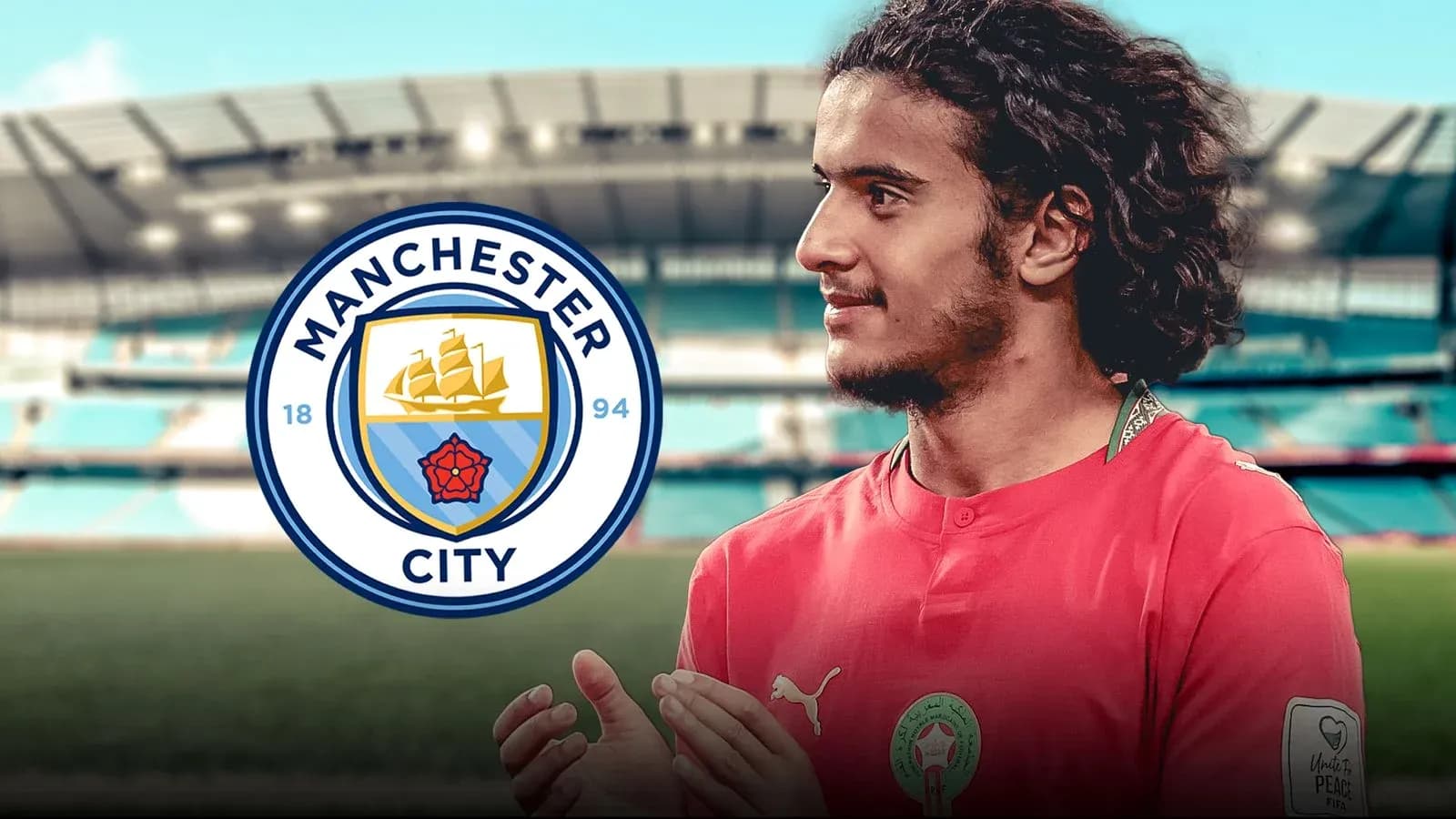 Joueur de Manchester City avec le logo du club