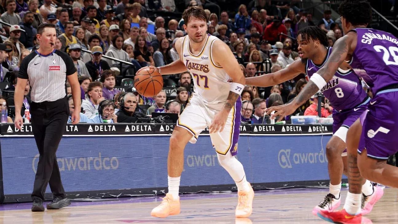 Joueur des Lakers dribblant le ballon sous pression