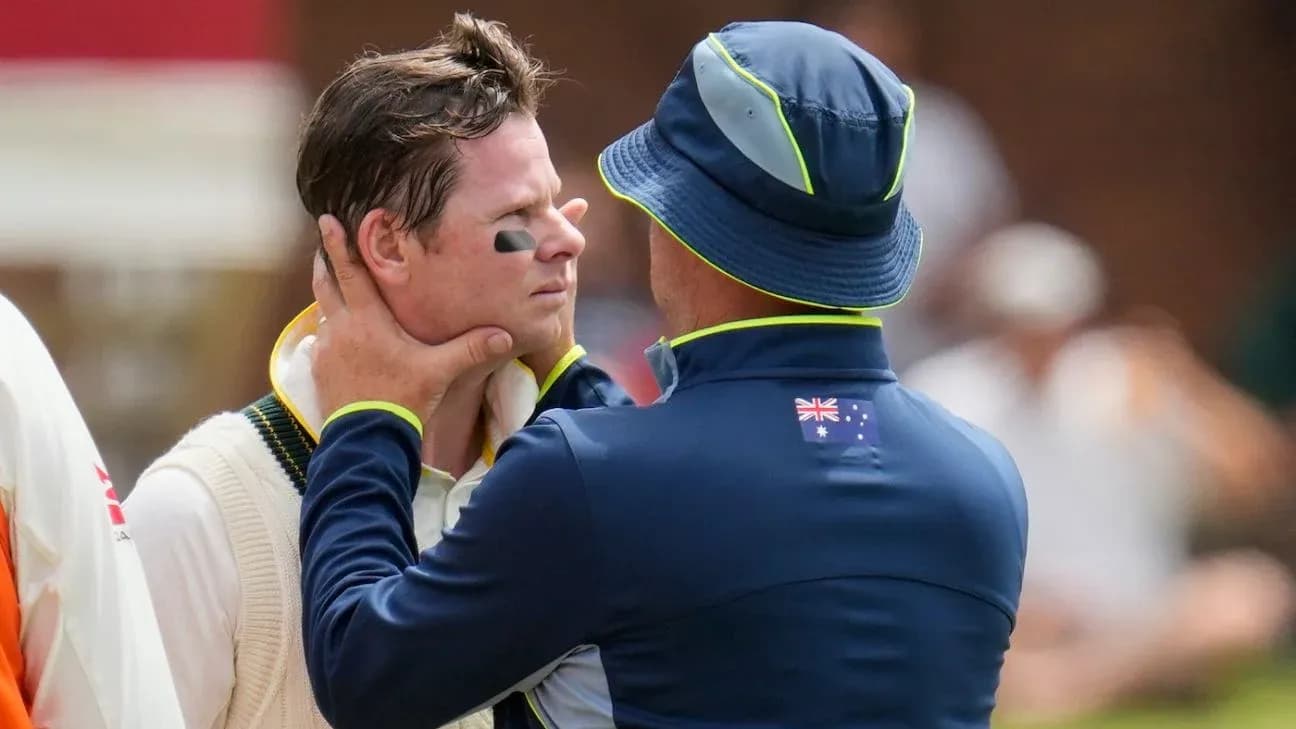 Un entraîneur parlant à un joueur de cricket