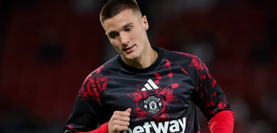 Joueur de Manchester United s'échauffant avant le match