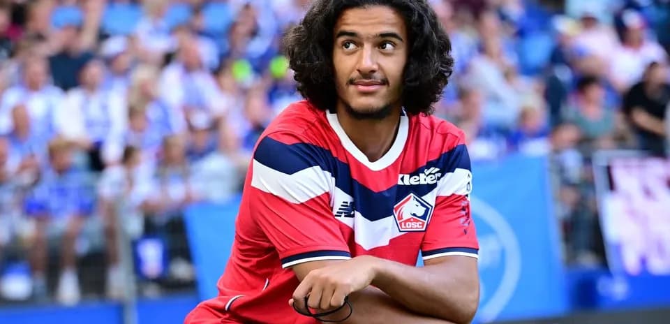 Joueur de Lille OSC assis sur le banc