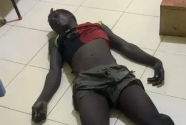 Person lying on the floor in a room