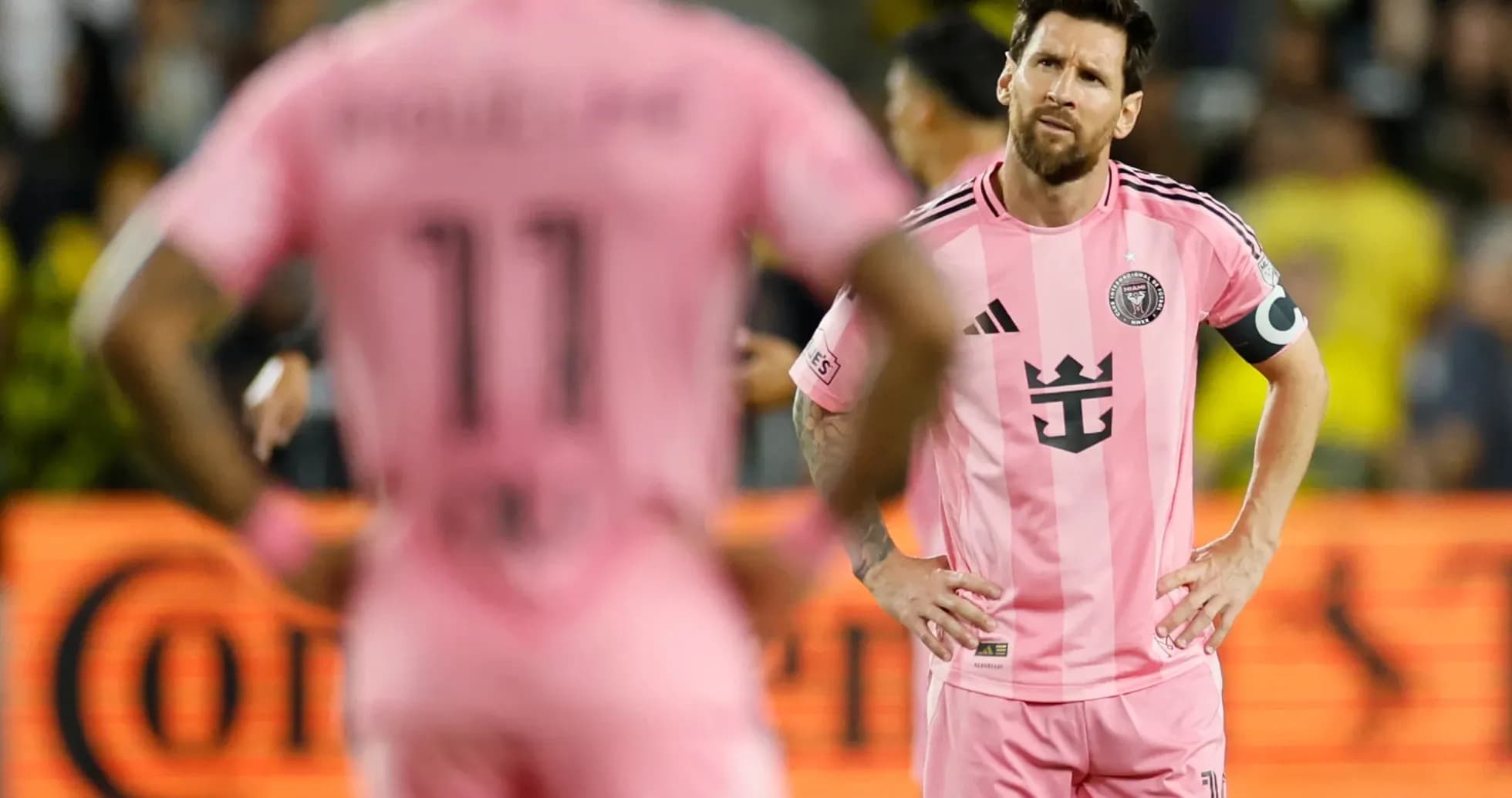 Lionel Messi and teammate during match in pink jerseys Lionel Messi and teammate during match in pink jerseys