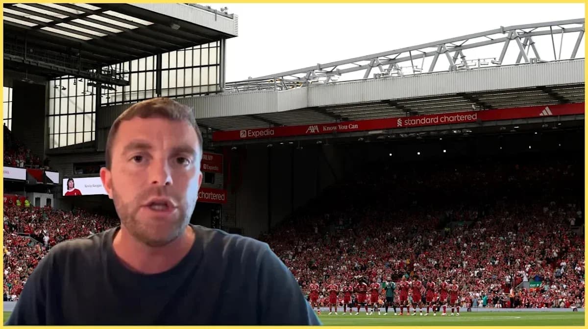 Person speaking in front of Anfield stadium crowd Person speaking in front of Anfield stadium crowd
