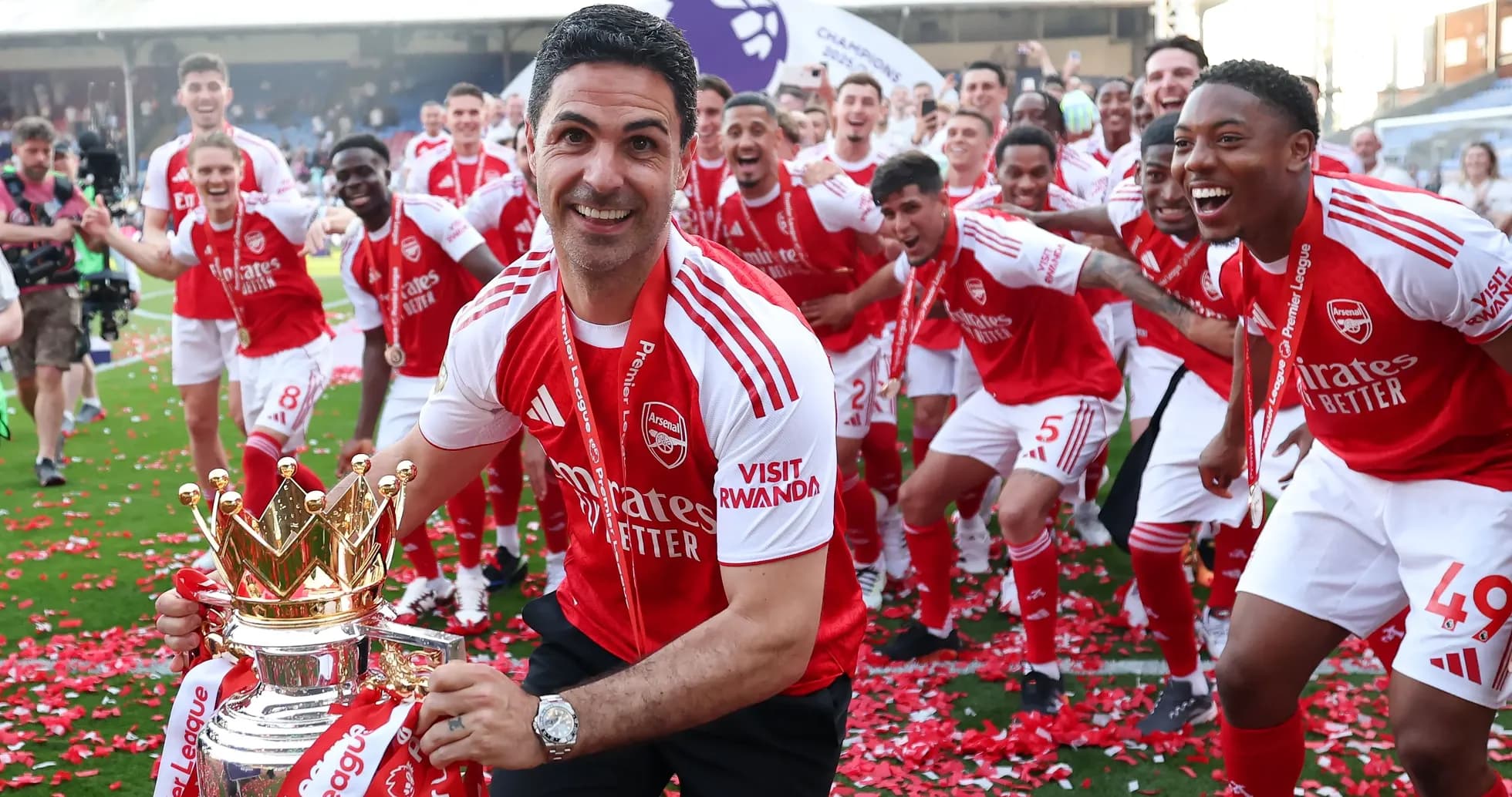 Mikel Arteta celebrating with Arsenal players and trophy Mikel Arteta celebrating with Arsenal players and trophy