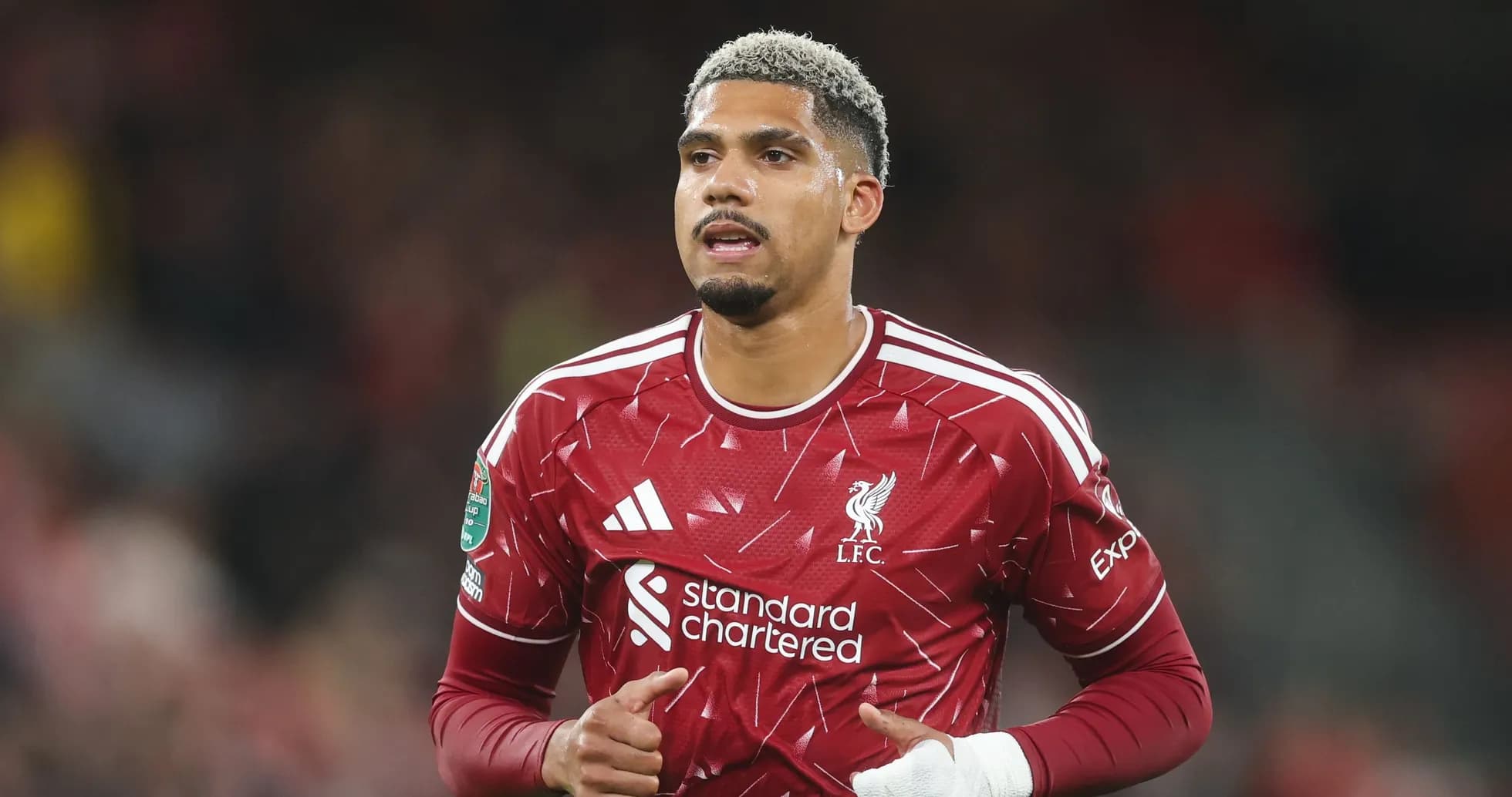 Joueur de Liverpool en action sur le terrain Joueur de Liverpool en action sur le terrain