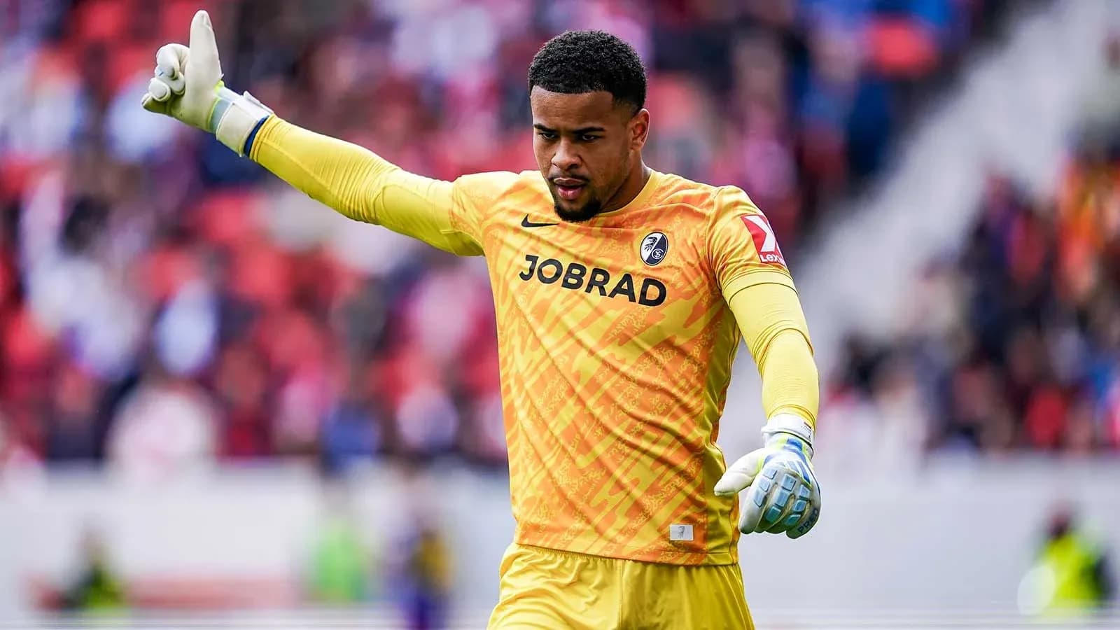 Gardien de but faisant un signe pendant le match Gardien de but faisant un signe pendant le match
