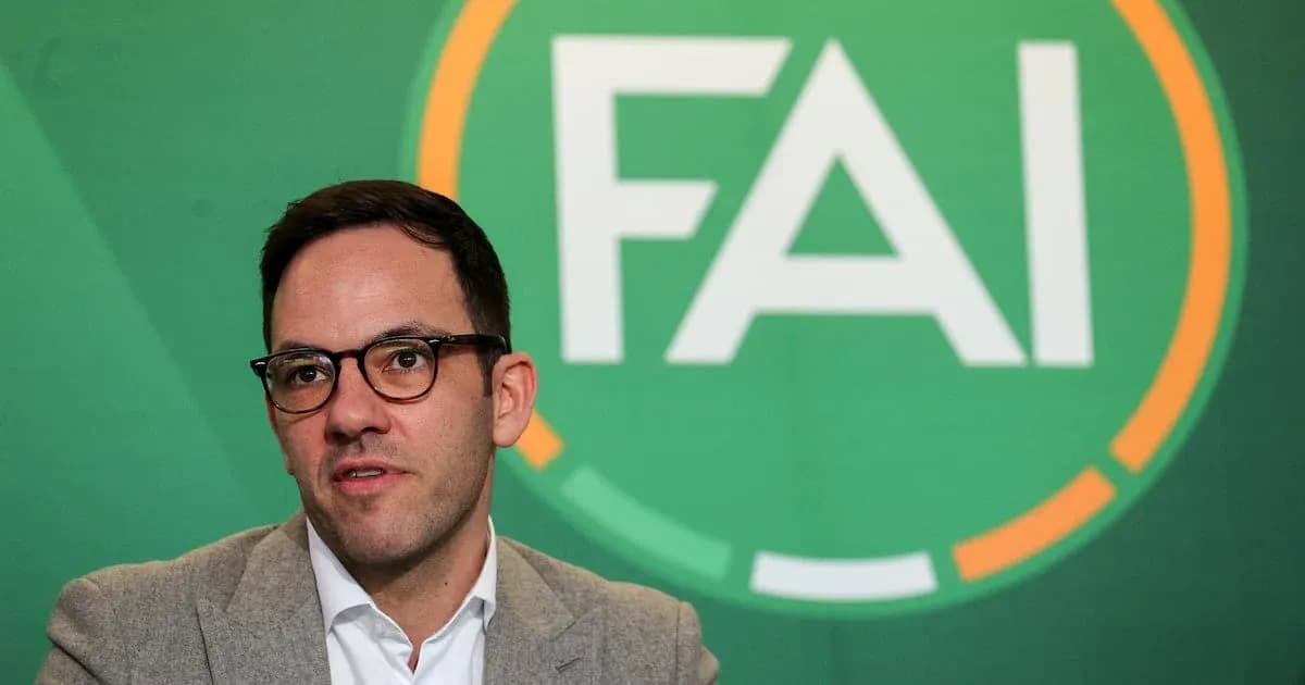 Person speaking at FAI press conference backdrop Person speaking at FAI press conference backdrop