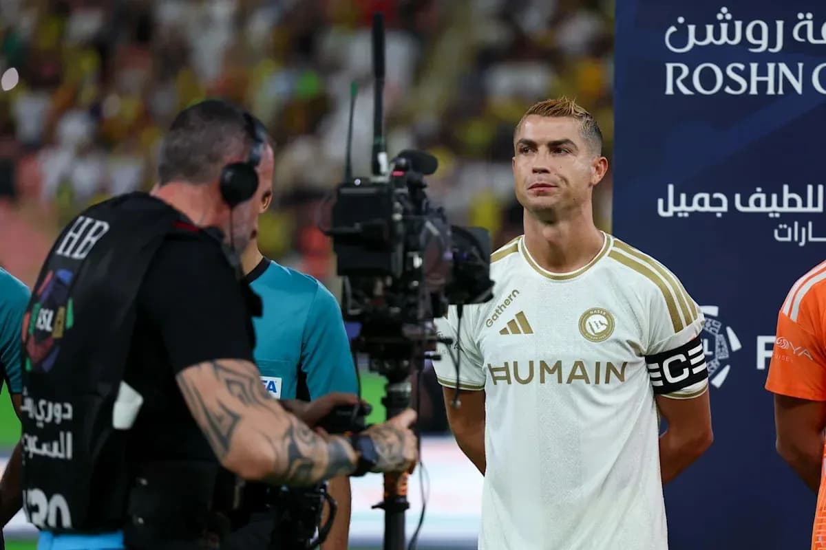 Cristiano Ronaldo standing before the match with camera Cristiano Ronaldo standing before the match with camera