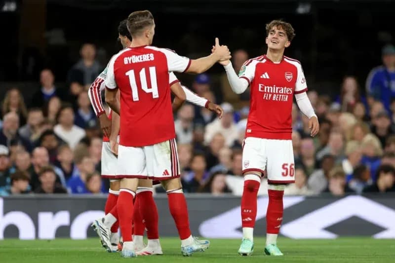 Joueurs d'Arsenal se félicitant lors du match Joueurs d'Arsenal se félicitant lors du match