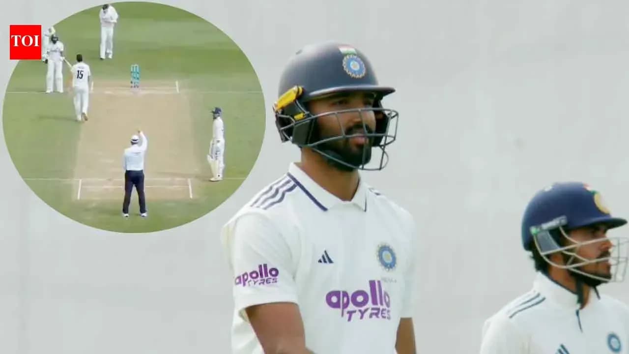 Batsman walking to crease during cricket match Batsman walking to crease during cricket match