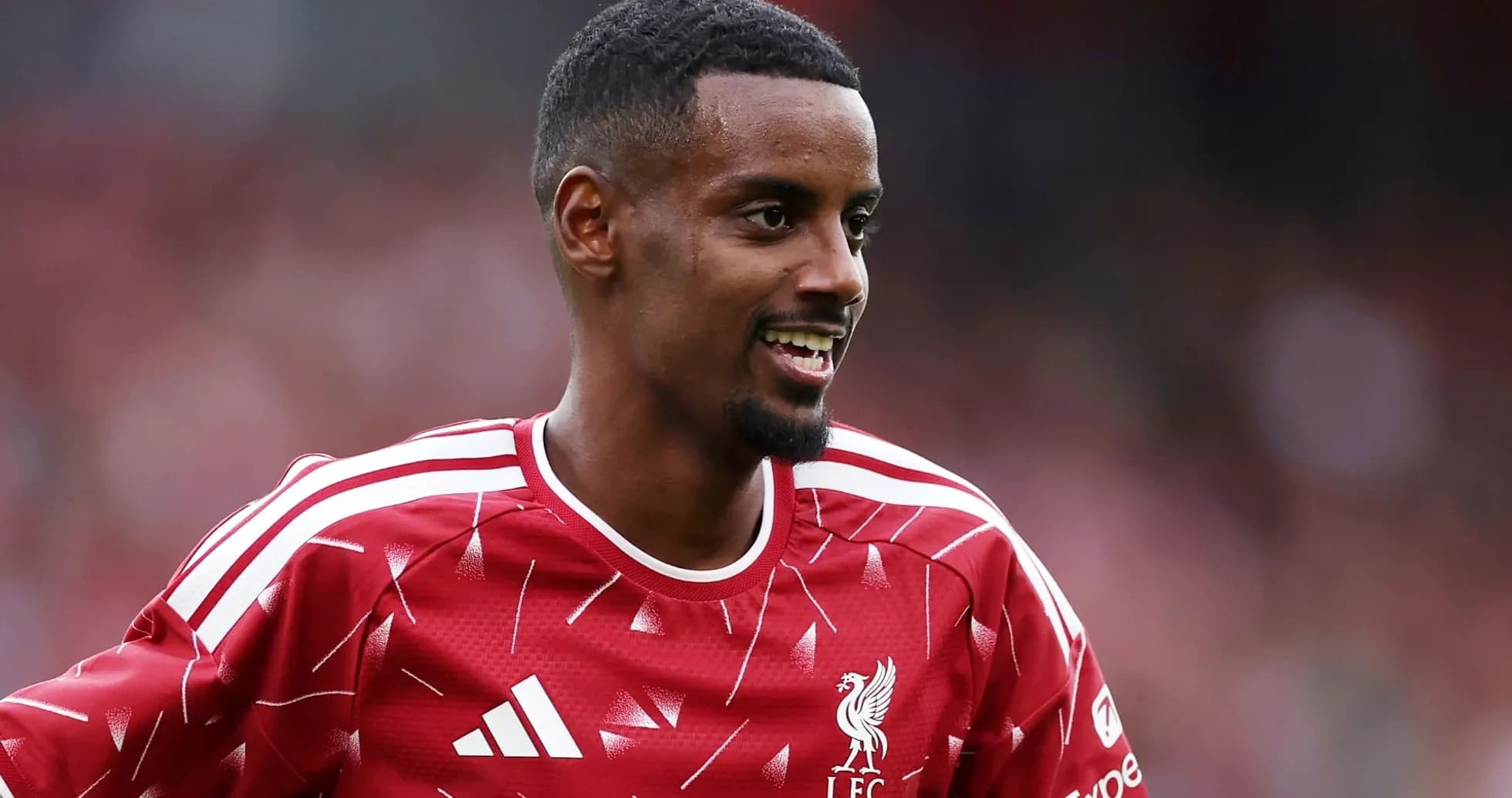Joueur de Liverpool souriant pendant un entraînement Joueur de Liverpool souriant pendant un entraînement