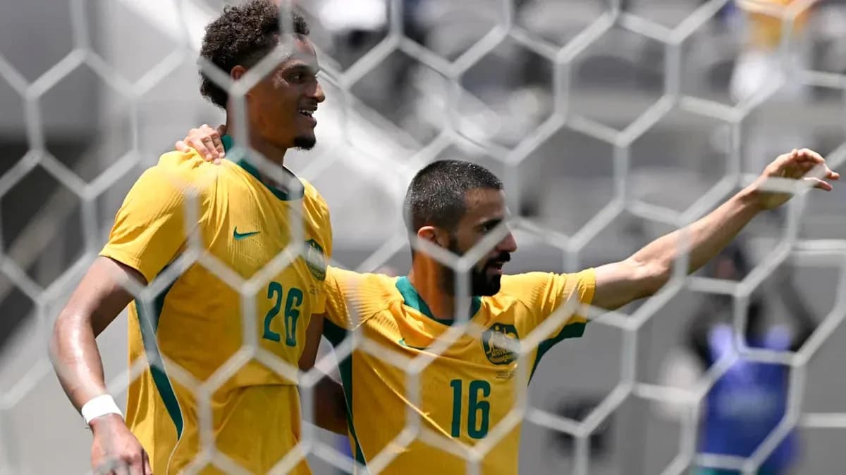 Joueurs australiens célébrant un but sur le terrain Joueurs australiens célébrant un but sur le terrain