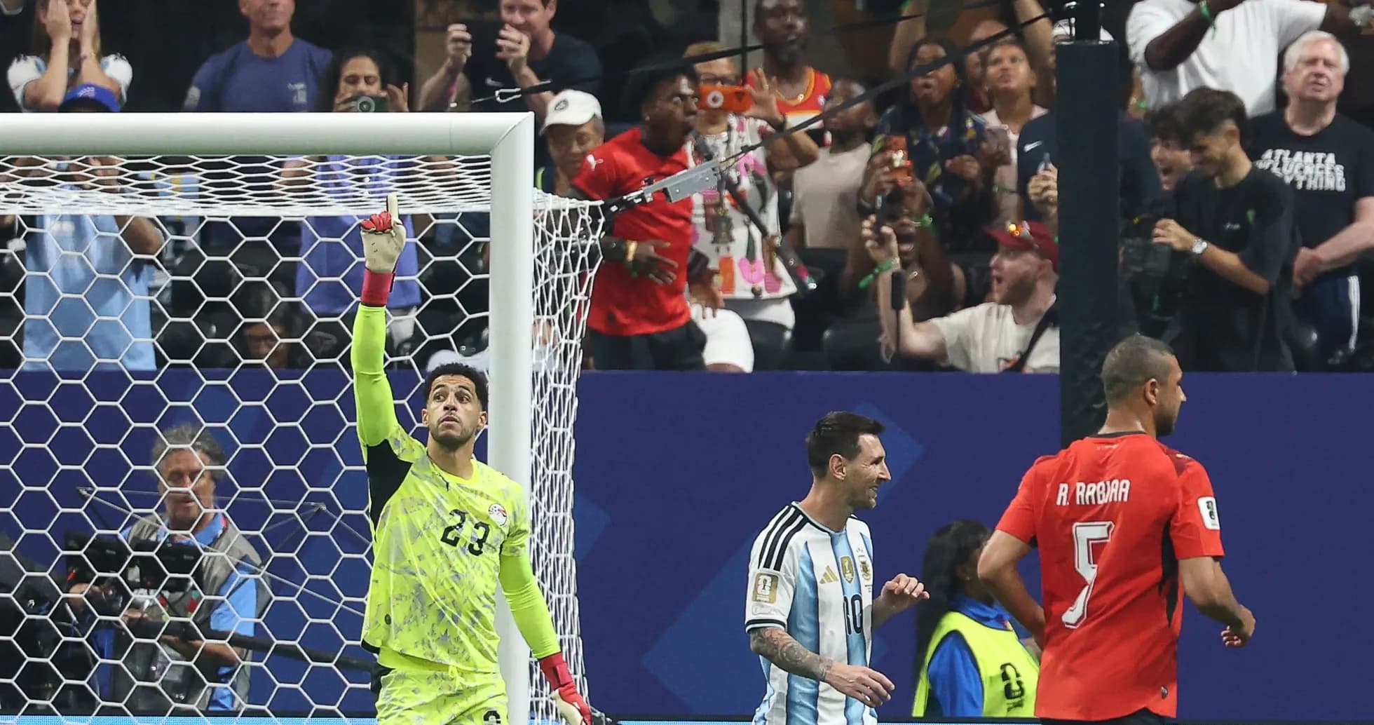 Goalkeeper celebrating a save during a match Goalkeeper celebrating a save during a match