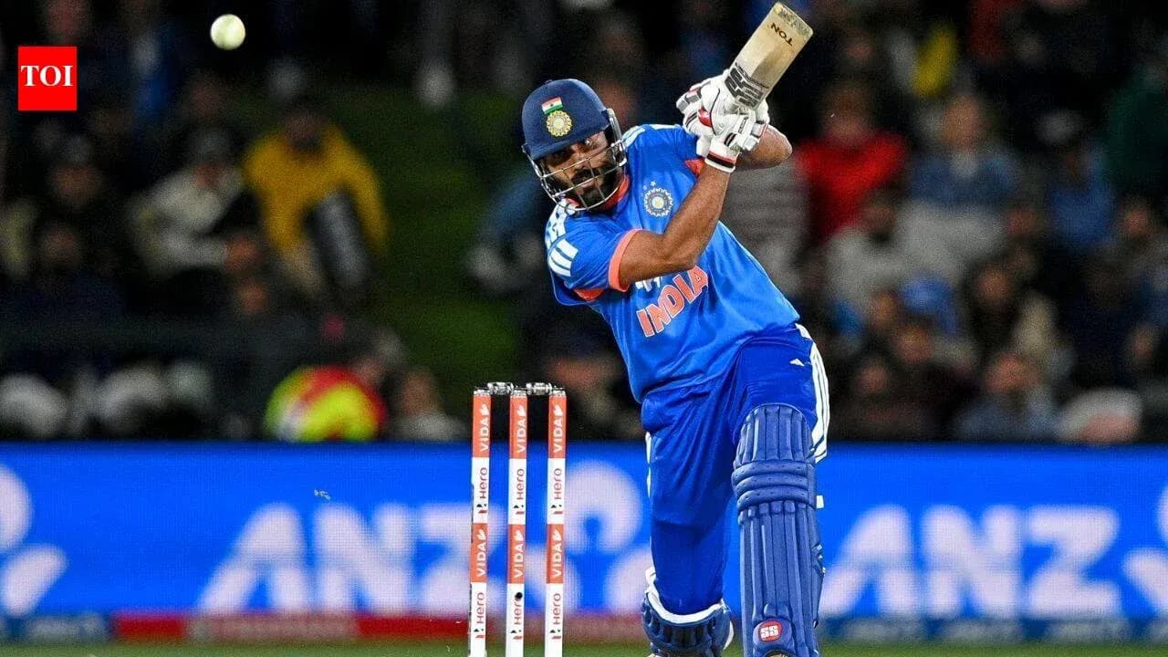 Joueur de cricket frappant la balle avec sa batte Joueur de cricket frappant la balle avec sa batte