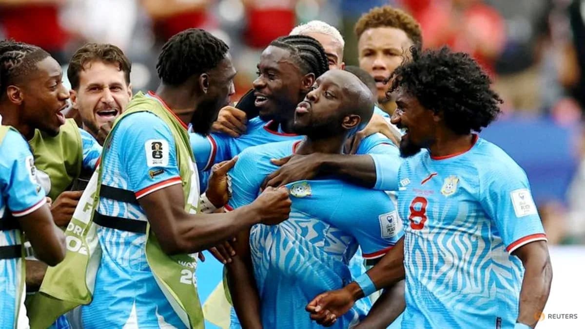 Joueurs célébrant un but lors d'un match Joueurs célébrant un but lors d'un match