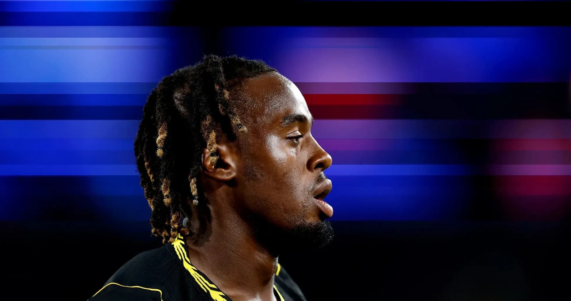 Athlete in profile with blurred background colors Athlete in profile with blurred background colors