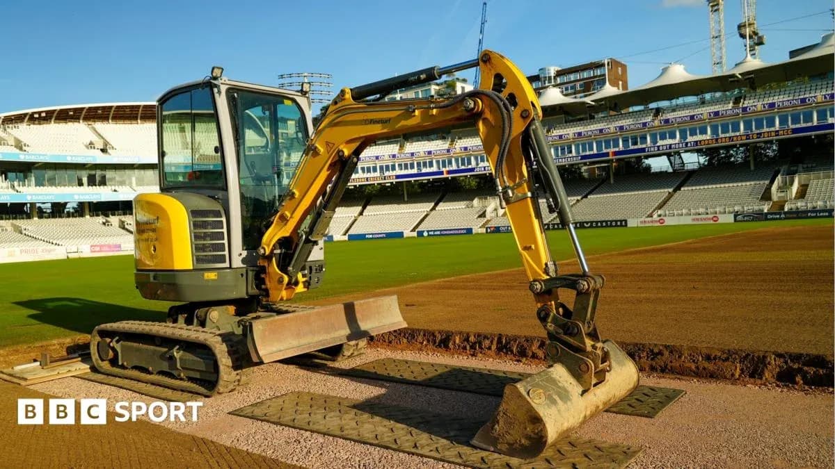 Excavator on cricket field preparing the pitch Excavator on cricket field preparing the pitch
