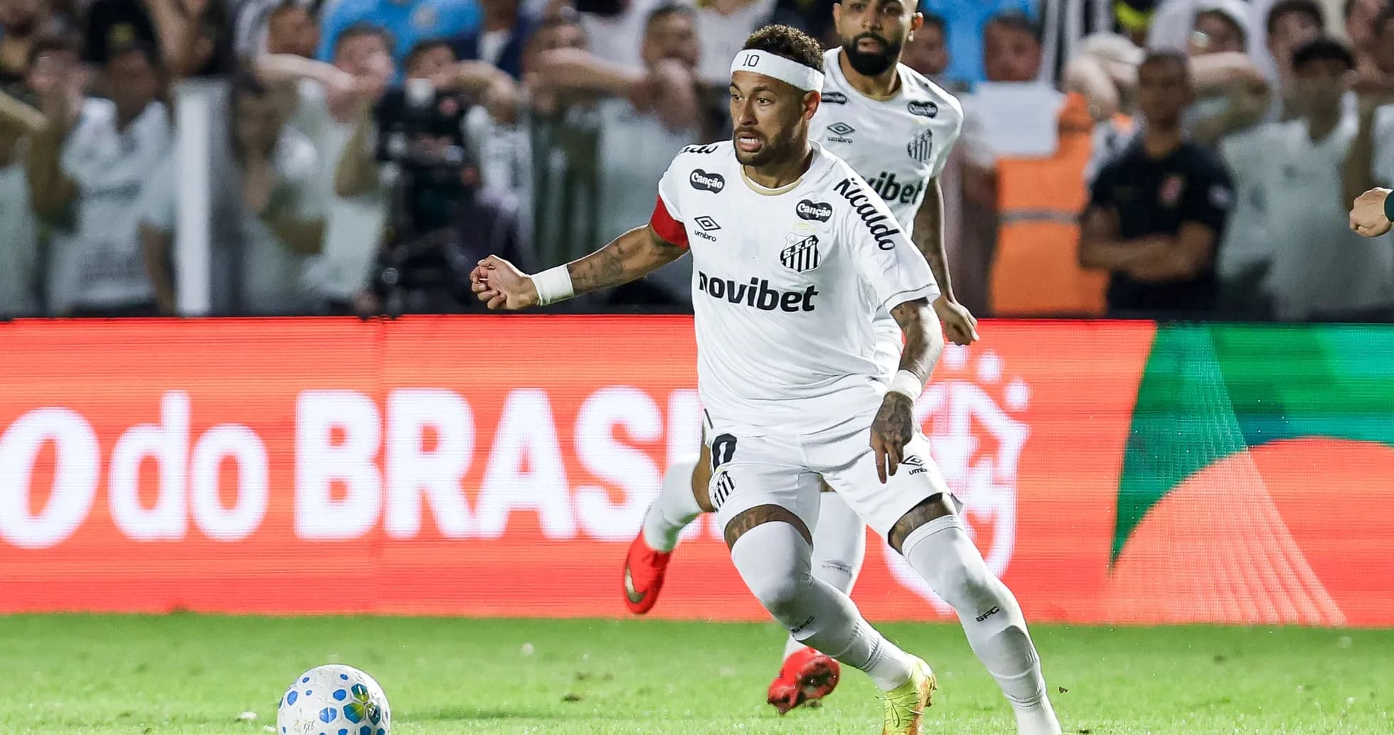 Neymar dribbling the ball during Santos match Neymar dribbling the ball during Santos match