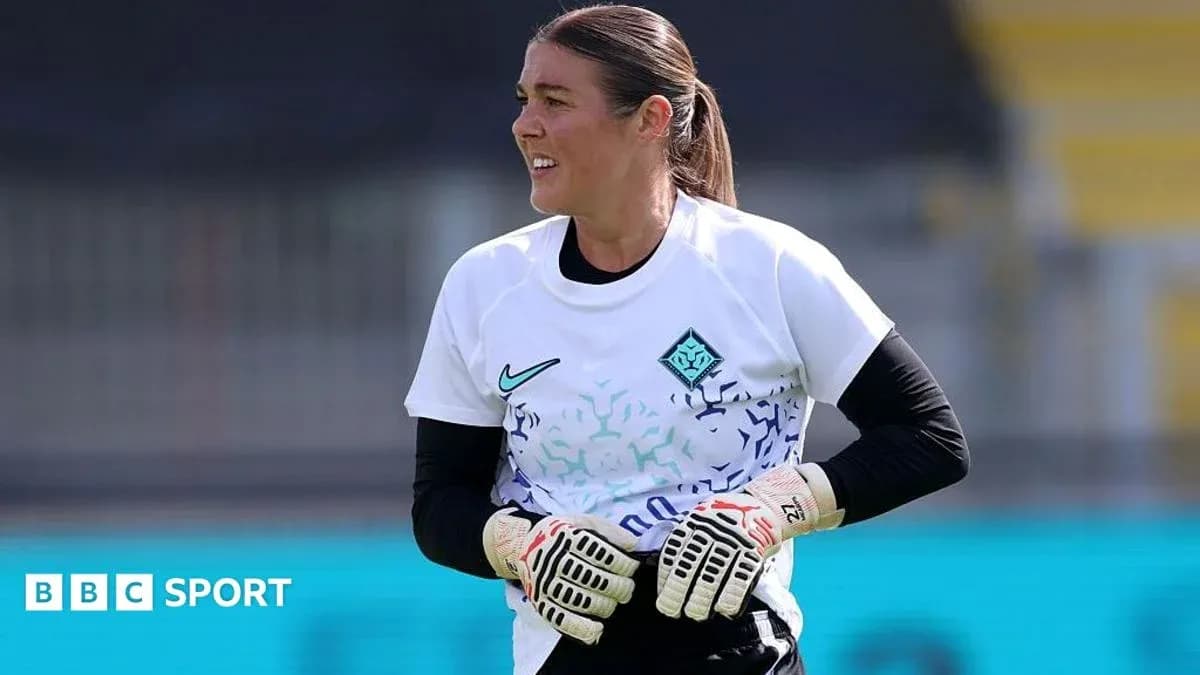 Gardienne de but en entraînement avec gants Gardienne de but en entraînement avec gants