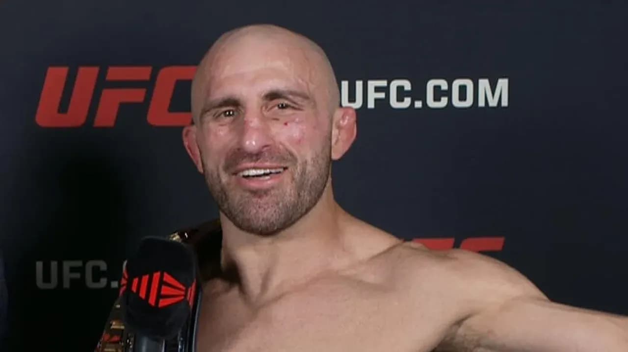 Fighter holding championship belt during interview Fighter holding championship belt during interview