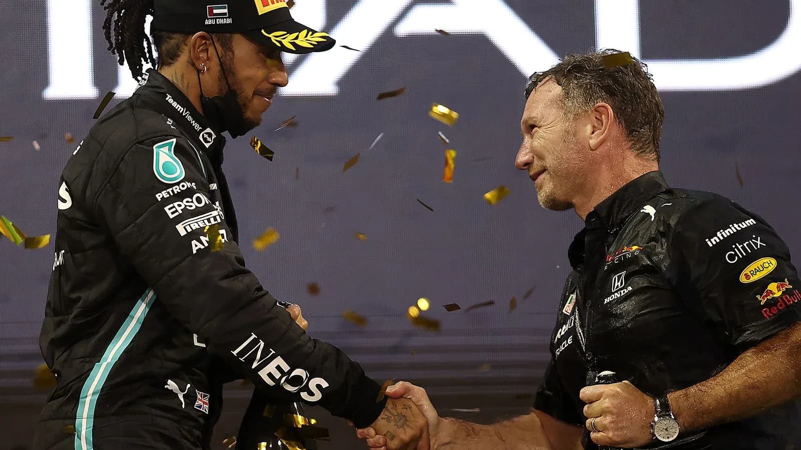 Lewis Hamilton shaking hands with team principal Lewis Hamilton shaking hands with team principal