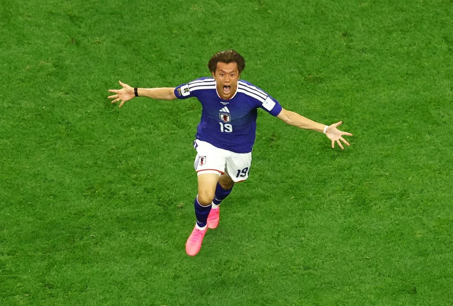 Joueur japonais célébrant un but Joueur japonais célébrant un but