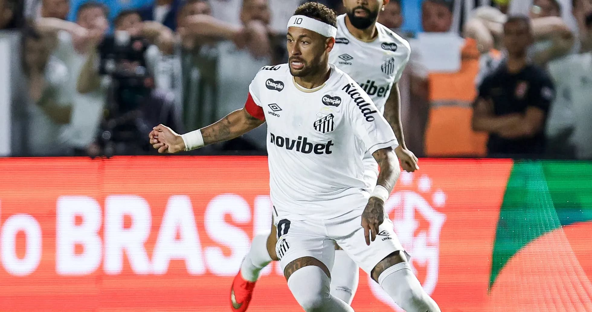 Neymar dribbling the ball during a match Neymar dribbling the ball during a match